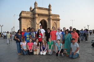 Student groups and teachers on the plaza in front of Mumbai's Gate of India.