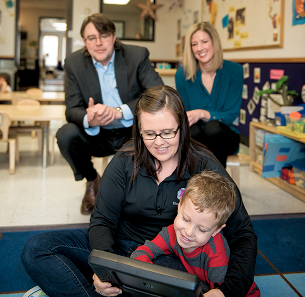 Fun, easy, and accurate: Phil Zelazo and Stephanie Carlson observed as three-year-old Mason played the game-like Minnesota Executive Function Scale app on an iPad, administered by Kinderberry teacher Maegan Recksiedler.