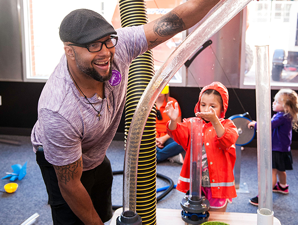 Photo: A dad plays alongside kids at the Minnesota Children's Museum.