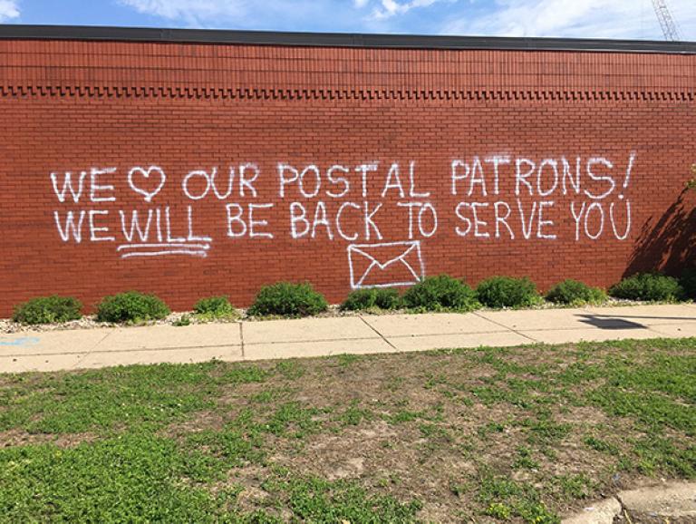 "We love our postal patrons.." art on post-office