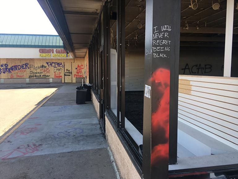 "I will never regret being black" writing on pillar