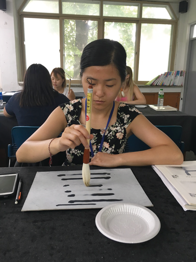 CEHD student Nancy Chang taking in a calligraphy class at SNUE, in 2016.