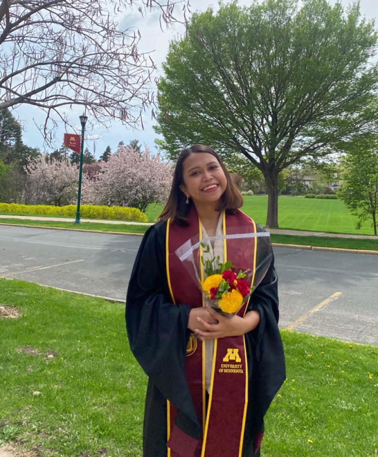 Devina Christianti wearing a graduation gown. 