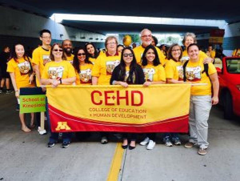 Dean with students at homecoming