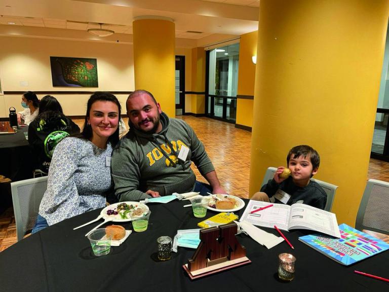 Special education PhD student Betul Dilek (left) and her family celebrate the CEHD International Thanksgiving.