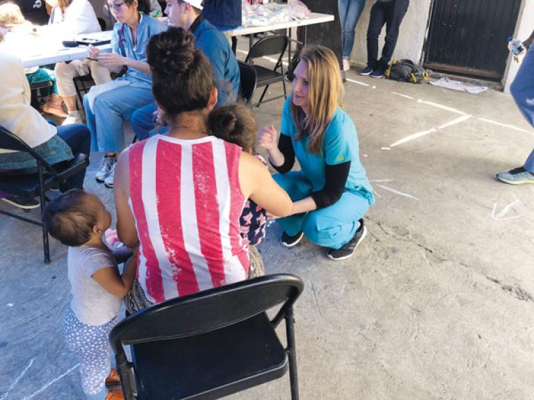 Katrina Cisneros meets with asylum seekers