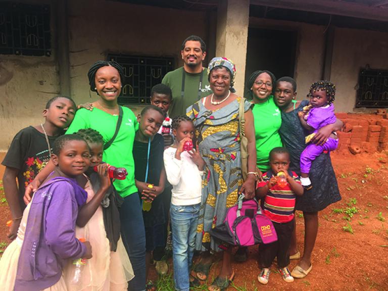 CEHD students and local residents celebrate sports day. In the middle is Queen Mary, a local community leader and one of CEHD’s global partners.