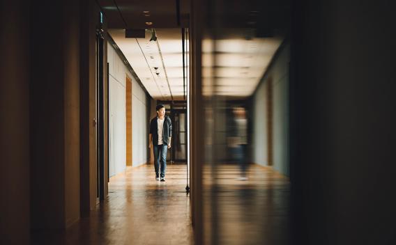 Student walking down a hall