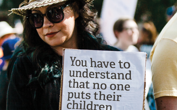 Woman holding a protest sign