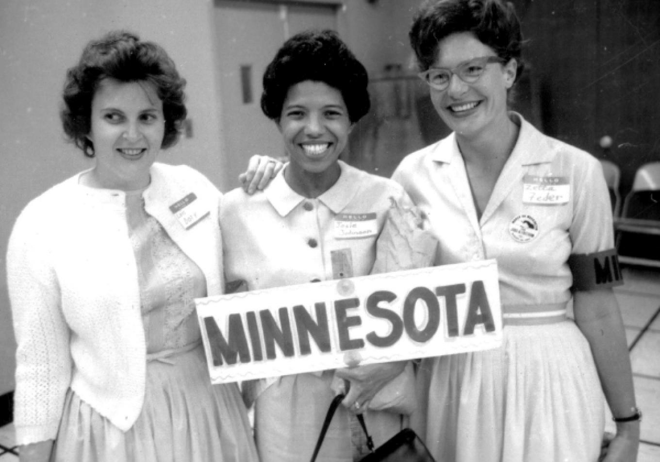 3  people holding Minnesota sign