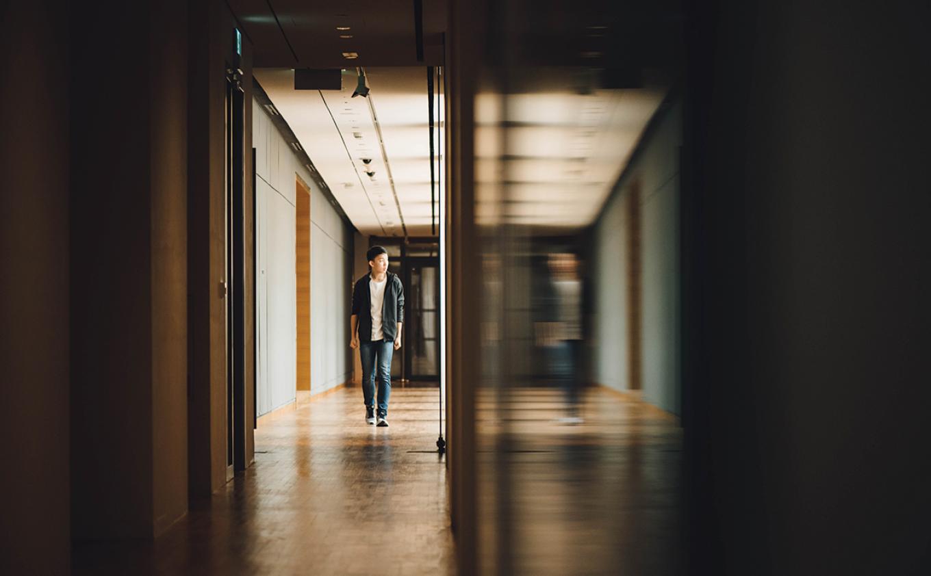 Student walking down a hall