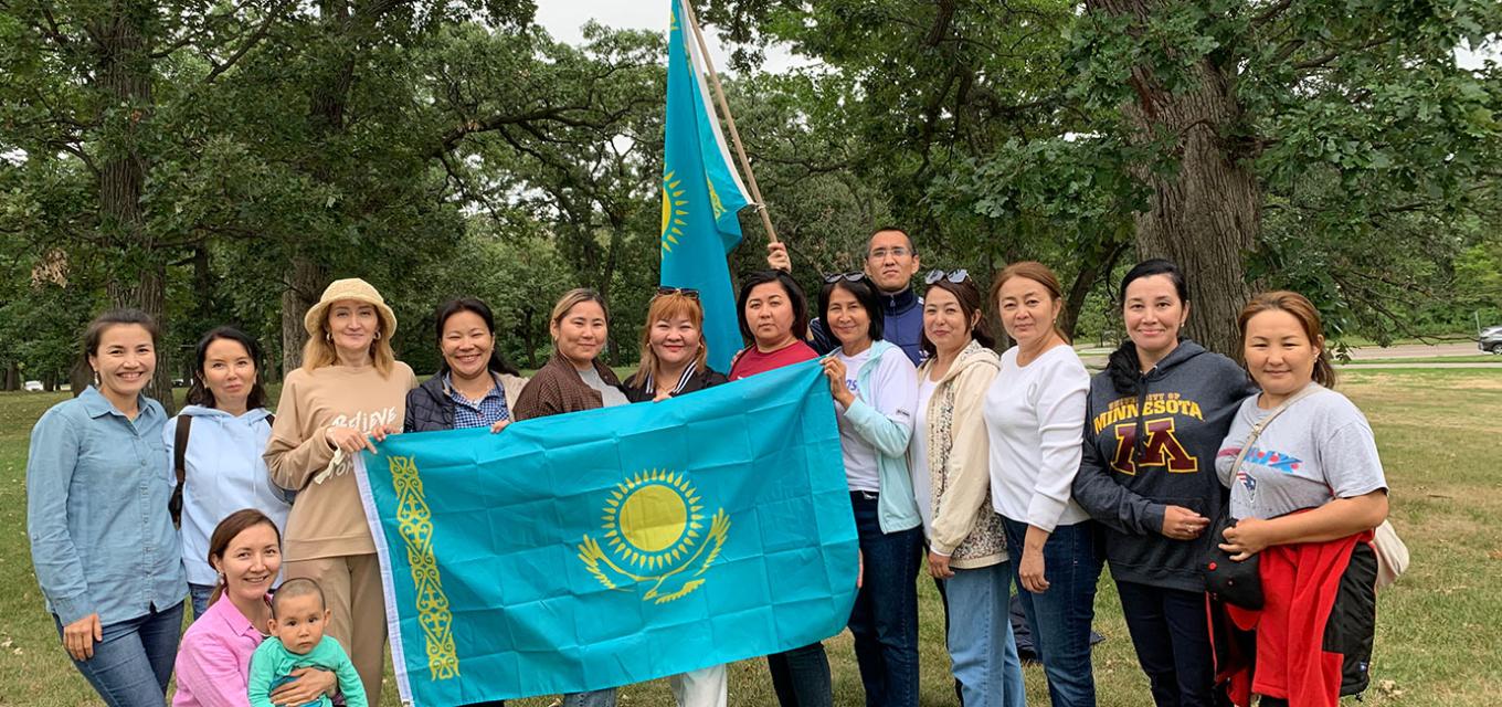 Kazakhstan scholars with flag of their homeland