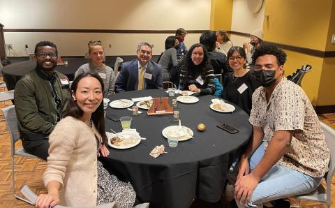 Dean Michael C. Rodriguez (middle) enjoys dinner and meeting new CEHD international students at the event.