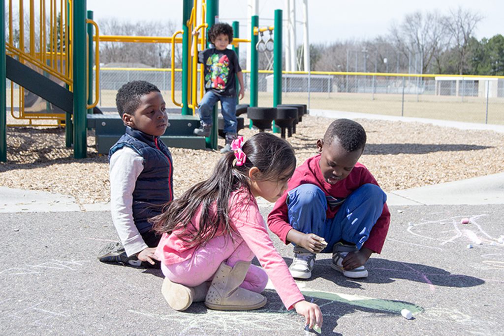 Robbinsdale preschool students play outside New Hope Learning Center.
