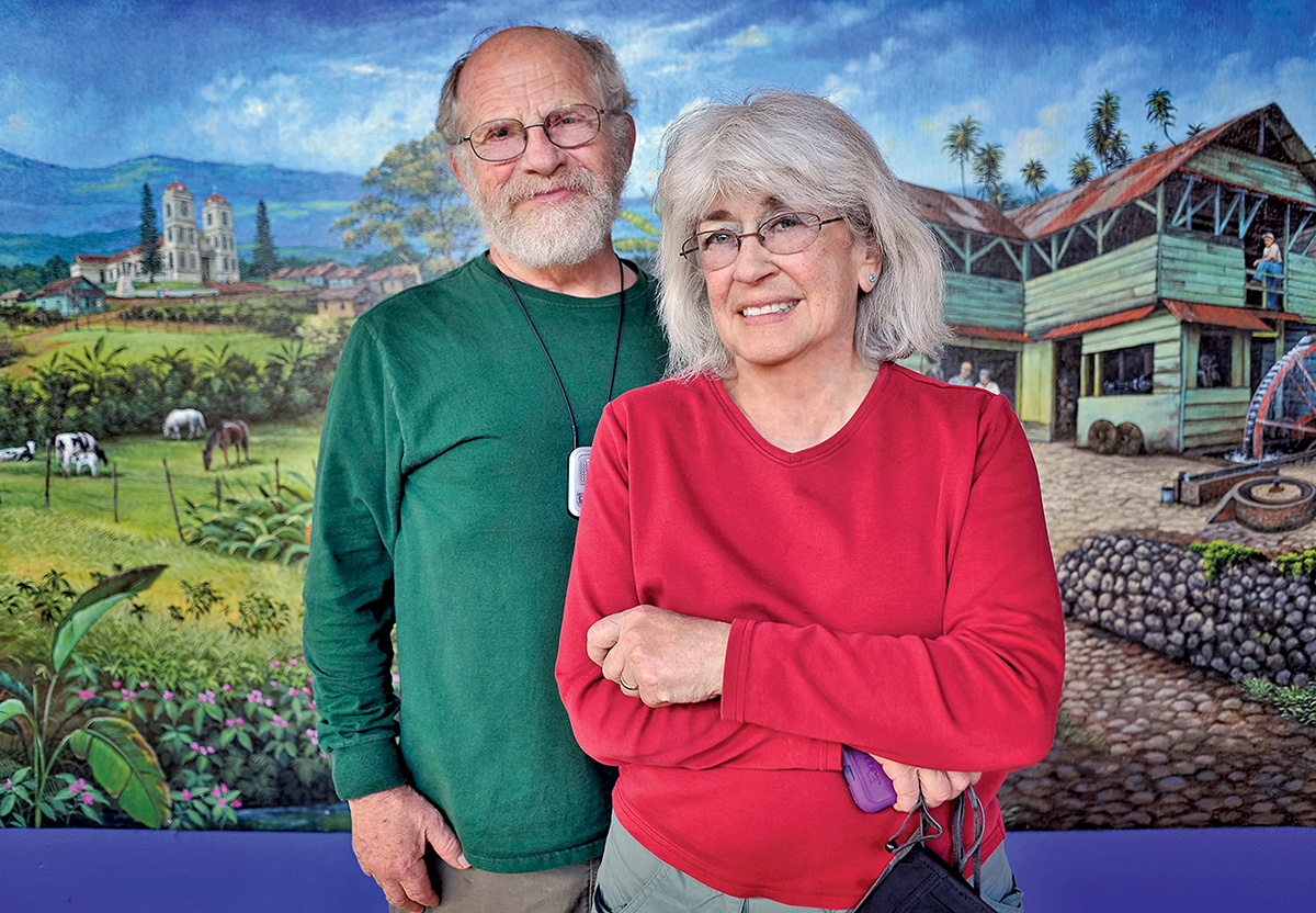 Mitch and Rachel Trockman pose in front of a mural.