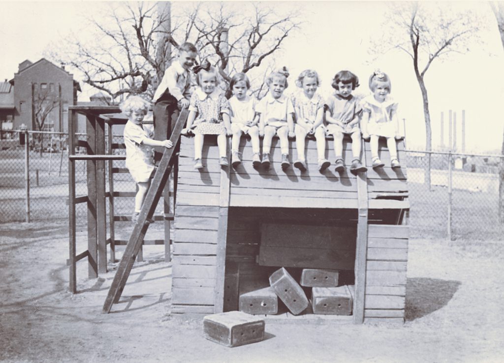 Black and white photo of children on a playground