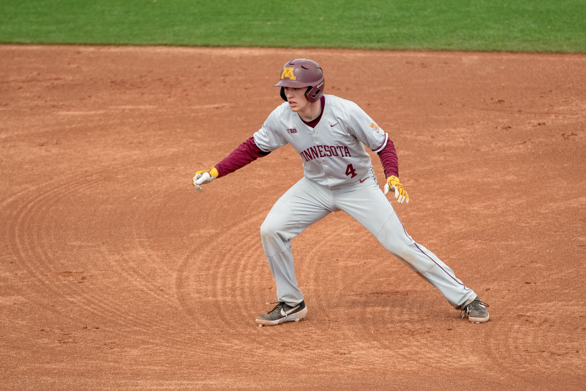 Gopher baseball player Eli Wilson leading off from a base