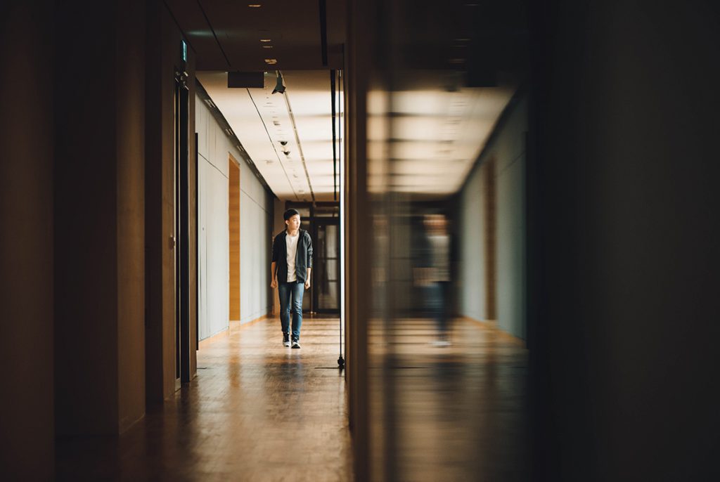 Student walking down a hall