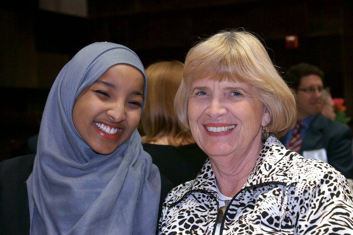 Veronica Johnson sitting with one of her scholarship recipients, Hafsa M. Mahad