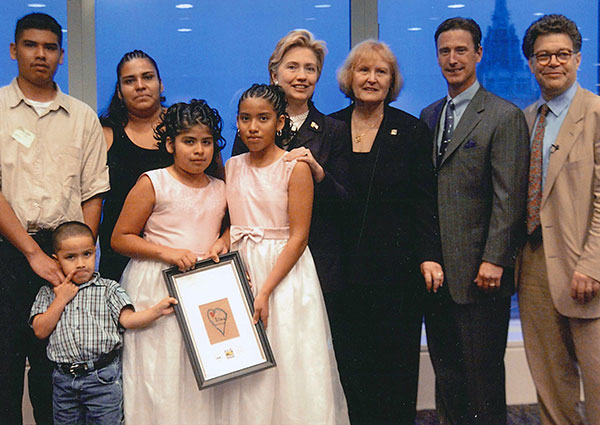 A group photo featuring Pauline Boss and Hillary Rodham Clinton at a New York fundraiser